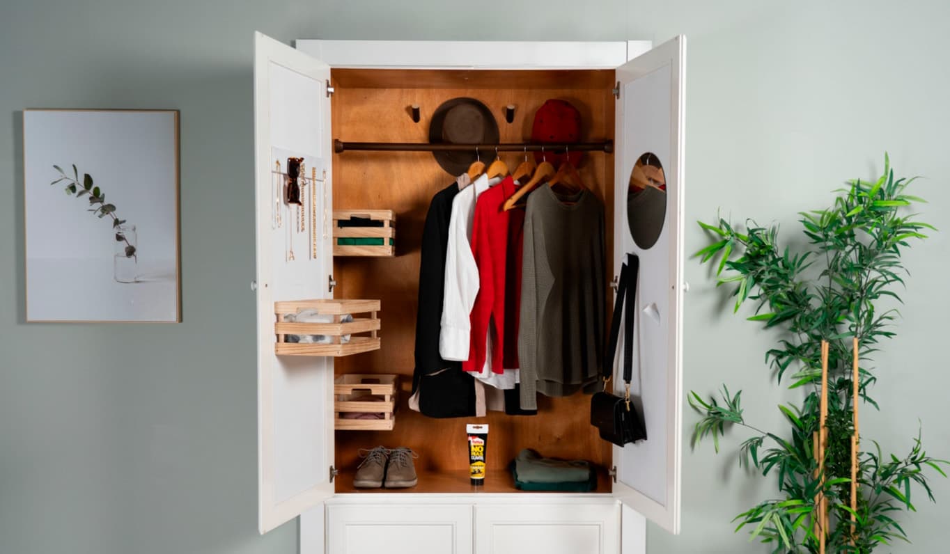 Closet with some clothes hanging