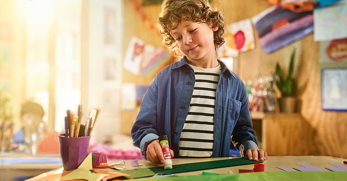 Kid in a blue shirt in a classroom