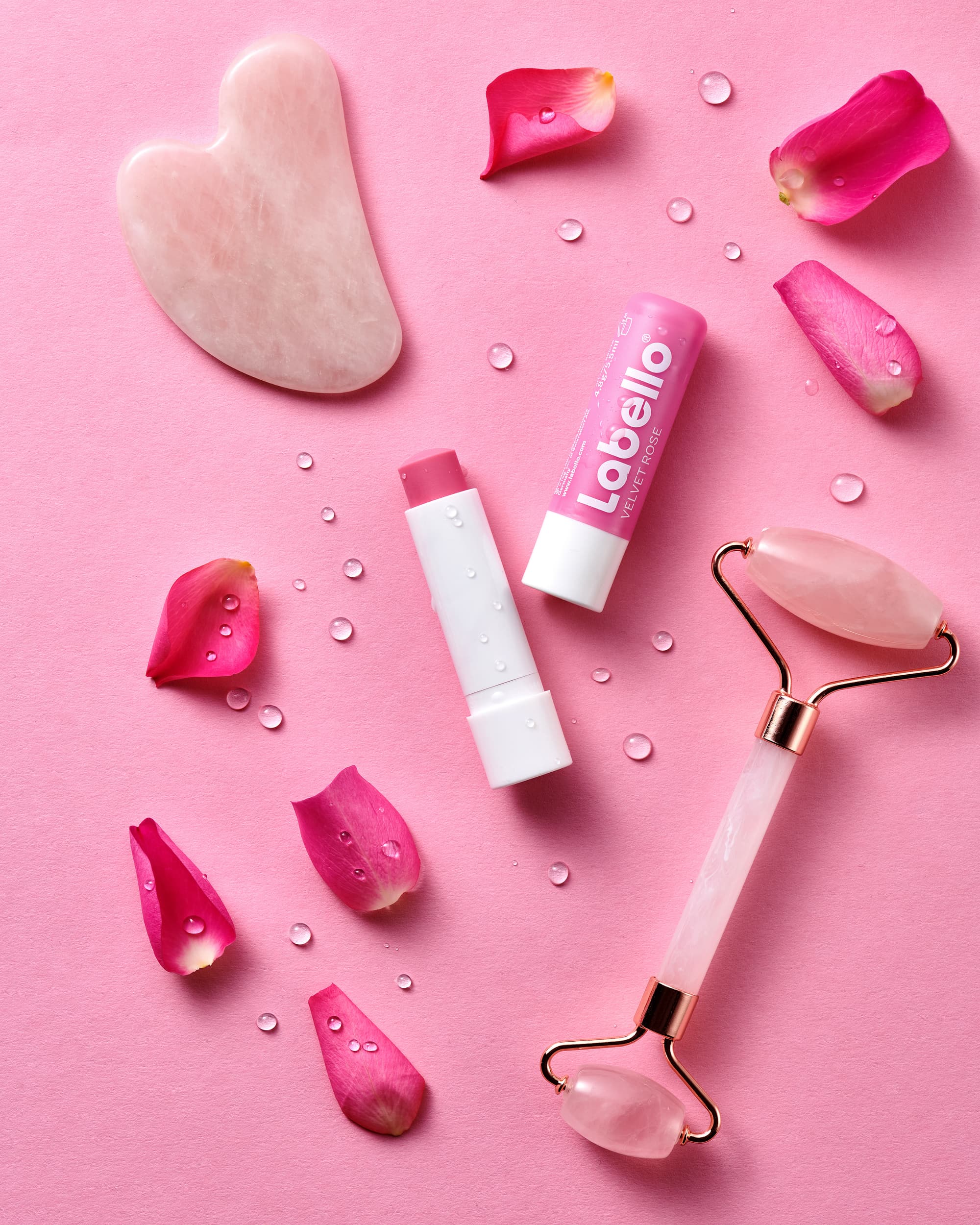 Pink grooming products on a pink background