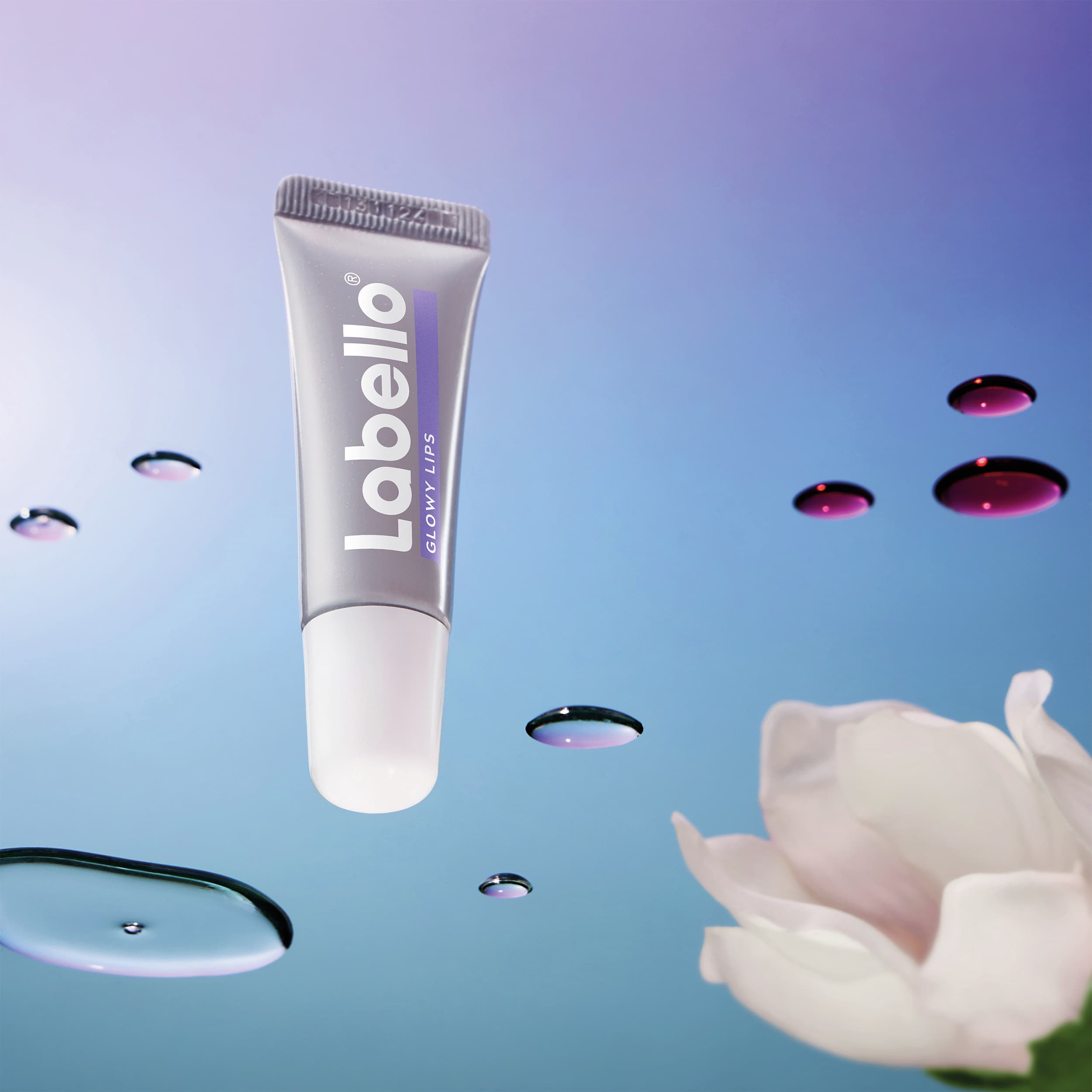 Silver lip balm on a watery surface