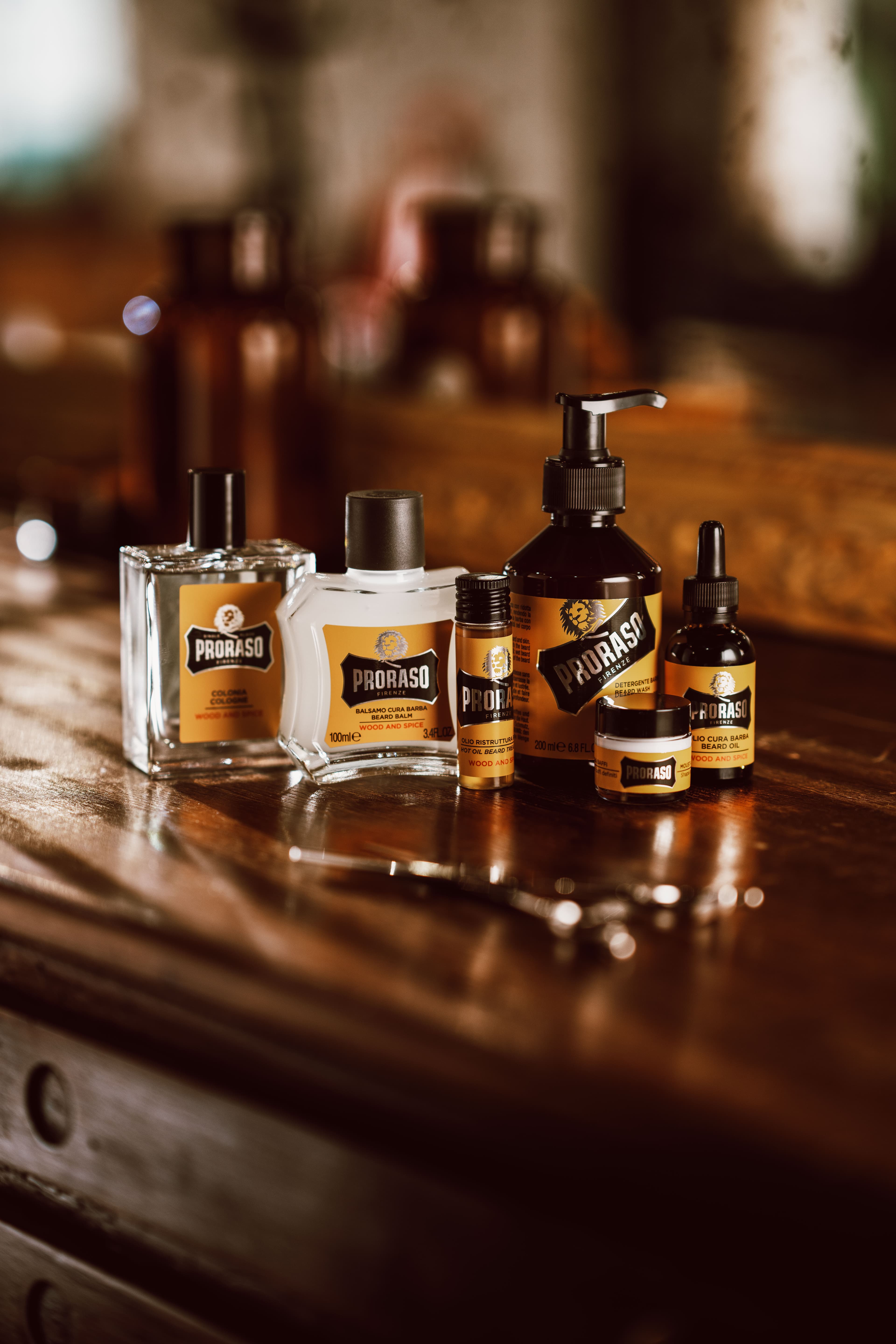 6 bottled products on a wooden counter