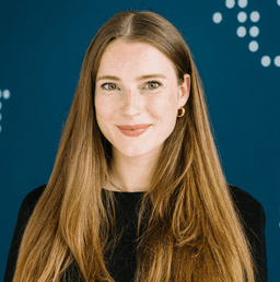 Woman with long brown hair on a blue background